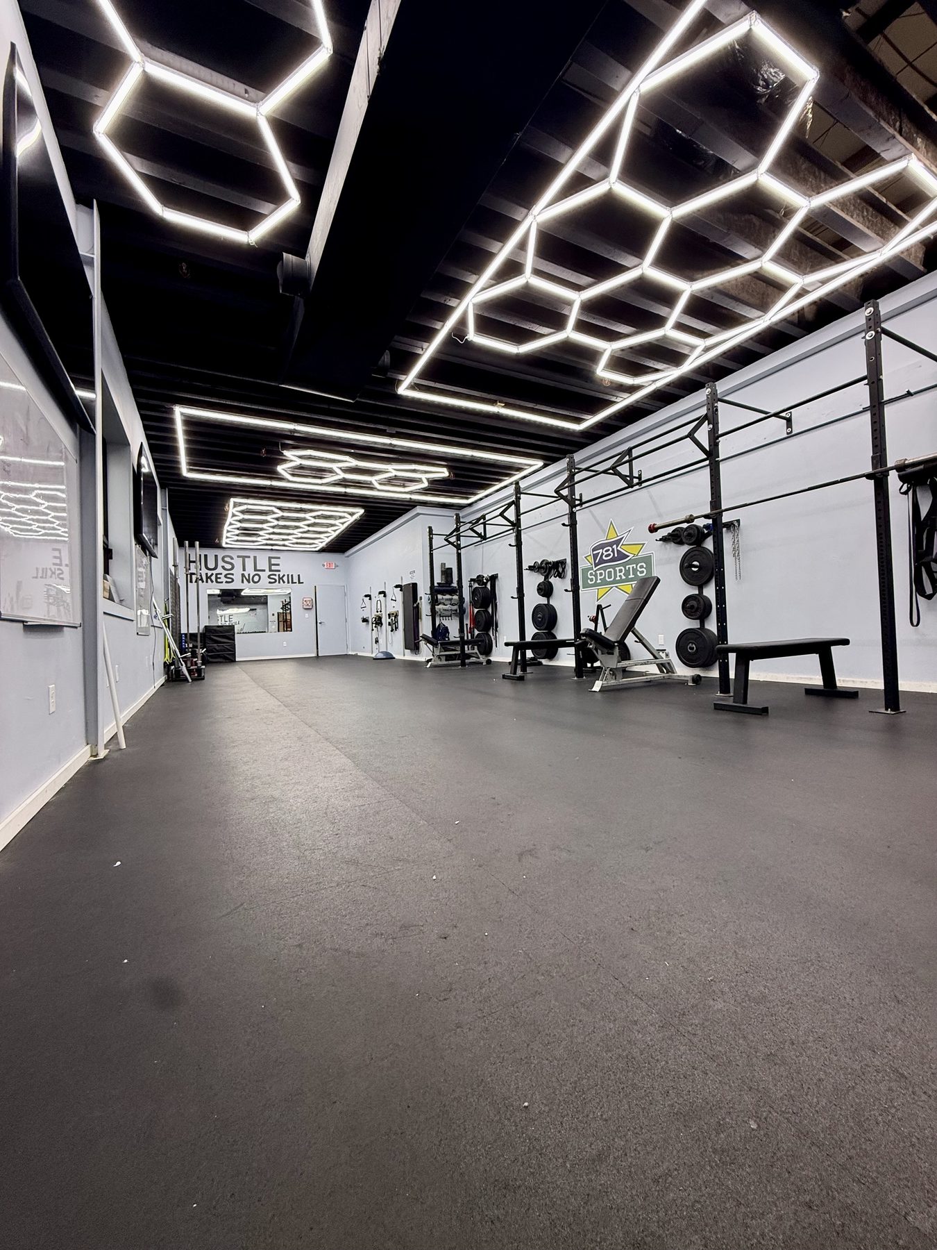The 781 strength room under hexagon lights