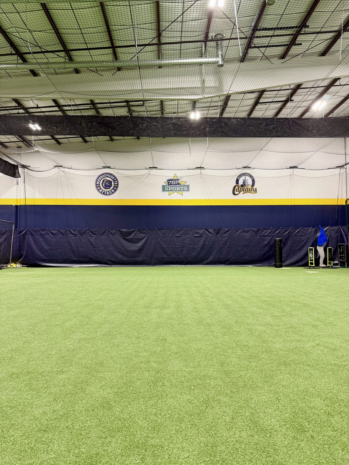The full turf with the club banners on the wall