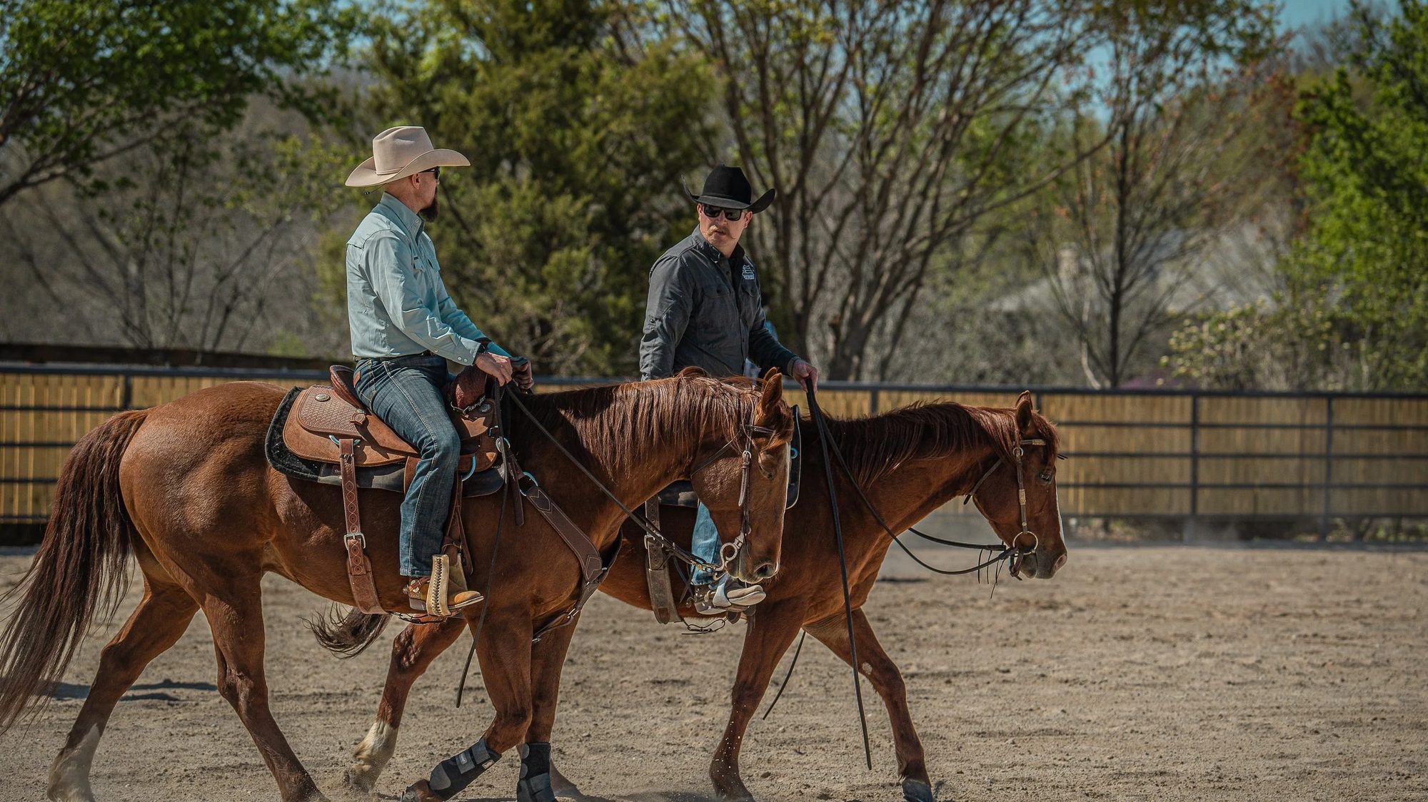 Two riders in the arena