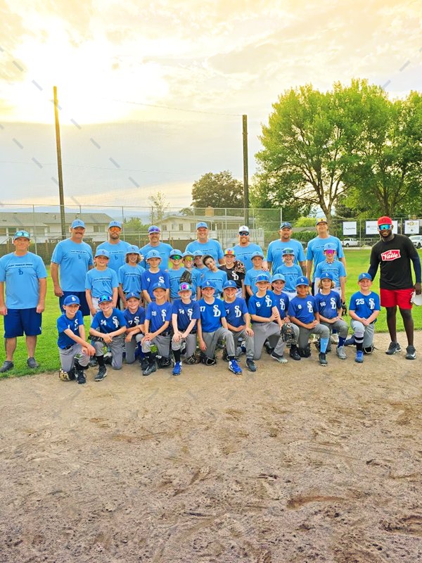 The team on the field at sunset