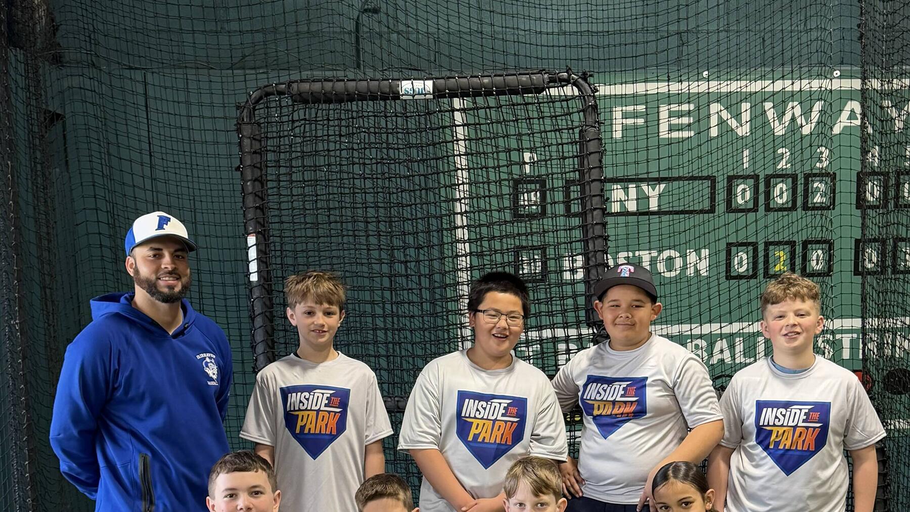 Coach and players in the cage at Inside the Park