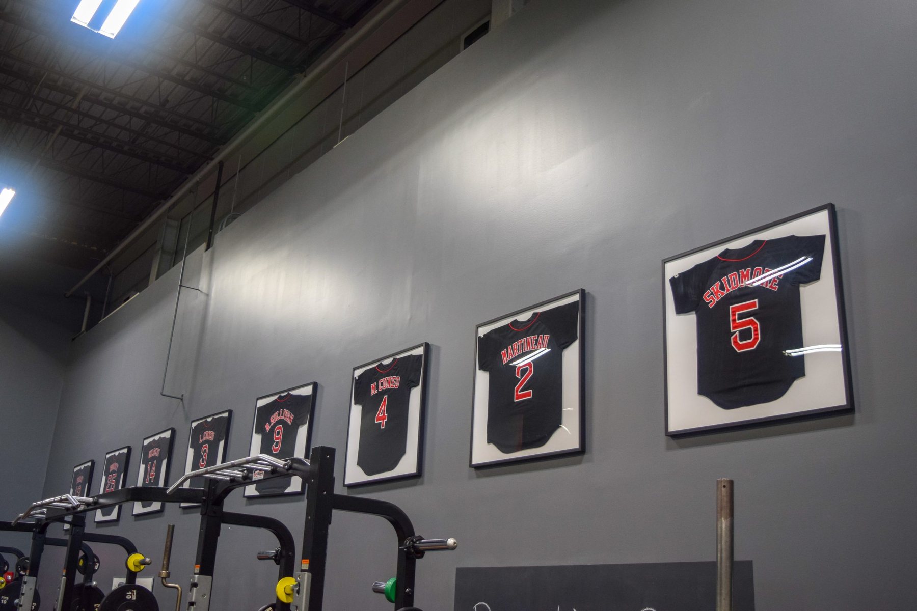 Framed Nokona jerseys on the wall at the NAC