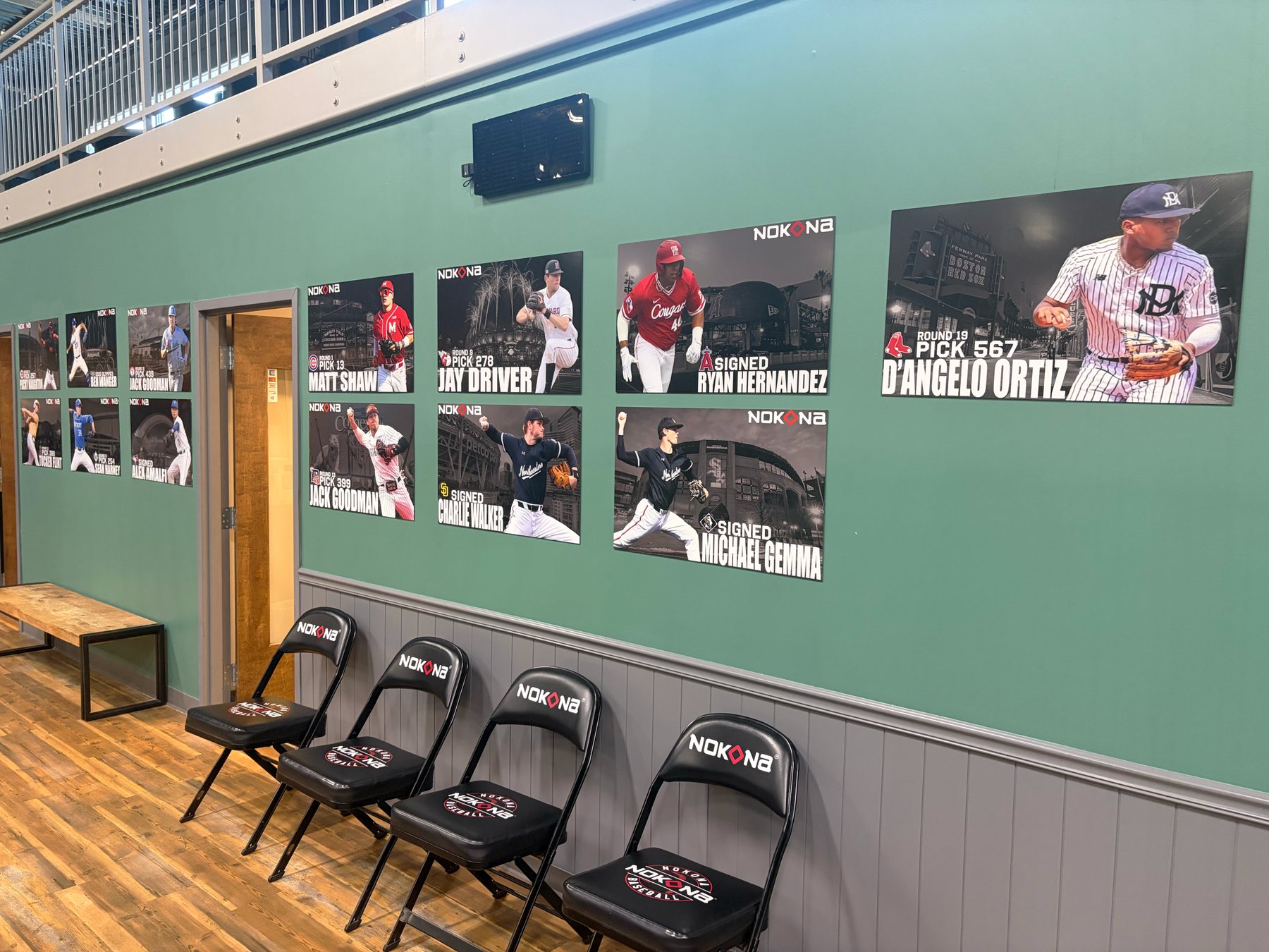 The wall of Nokona alumni in professional baseball at the NAC